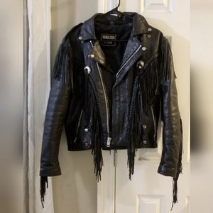 Real Vintage Leather motorcycle jacket w/ fringe and silver concho detail. 80's